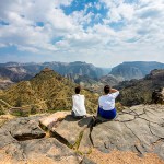 Oman, Jabal Akhdar, Two women looking at mountain view